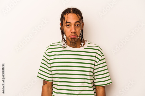 Young African American man isolated on white background sad, serious face, feeling miserable and displeased.