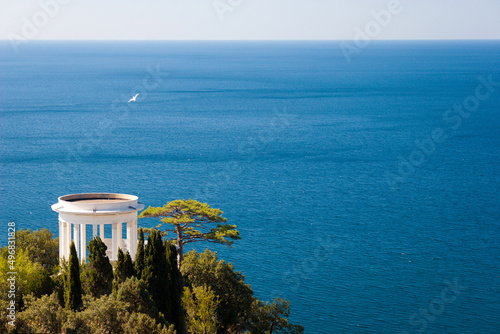 Fototapeta White alcove (gazebo) on a hill above the sea, Crimea