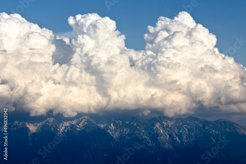The massif of Monte Baldo shrouded in summer clouds. Ferrara di Monte Baldo, Veneto, Italy.