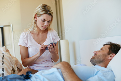 Wallpaper Mural Marriage can sometimes be hard work, but its worth it. Shot of a woman looking upset as she goes through her husbands phone. Torontodigital.ca