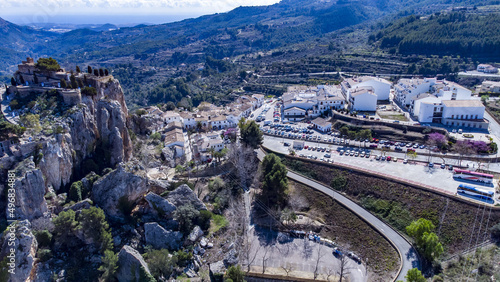 Bird's eye panoramic view of Castle San Jose and Guadalest town in bright sunlight, Alicante, Spain photo