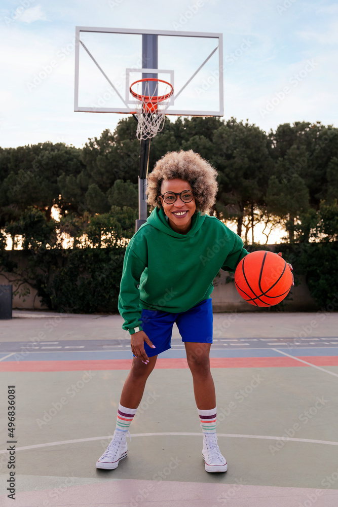 latin woman playing on the basketball court latin woman playing on the basketball court