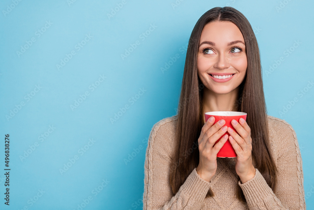 Portrait of attractive minded cheerful girl drinking latte thinking copy space isolated over bright blue color background Portrait of attractive minded cheerful girl drinking latte thinking copy space isolated over bright blue color background