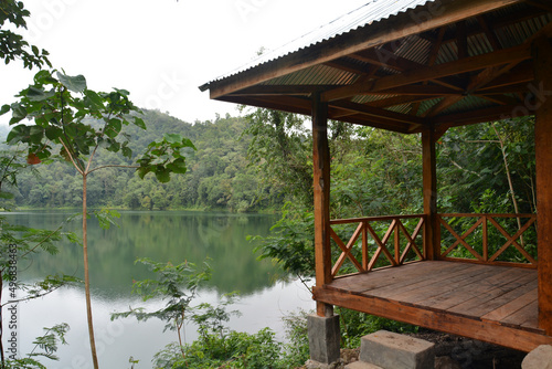 View of Ranamese lake and the surrounding forest and a wooden summer house photo
