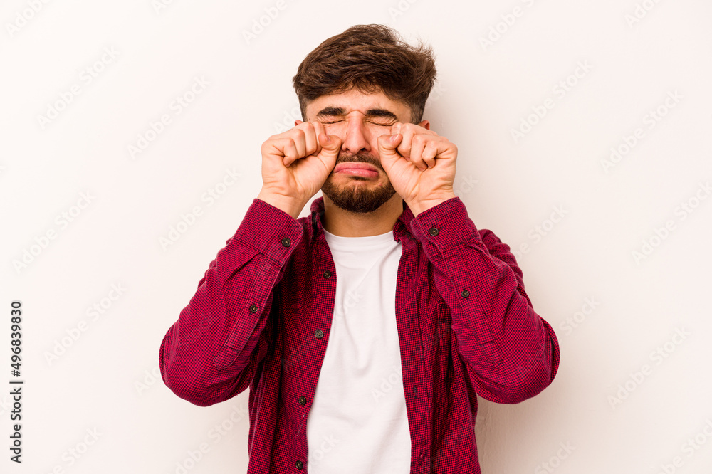 Young hispanic man isolated on white background whining and crying disconsolately. Young hispanic man isolated on white background whining and crying disconsolately.