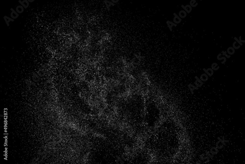 Distressed white grainy texture. Dust overlay textured. Grain noise particles. Snow effect. Rusted black background. Vector illustration, EPS 10. 