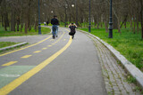 bicycle path in a public park. photo during the day.