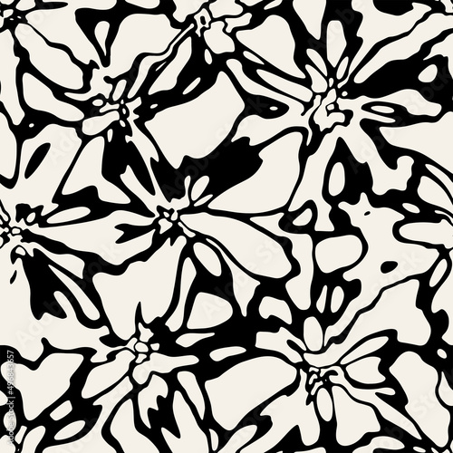 Vector seamless pattern. Stylish background with abstract flowers. Monochrome floral theme. Contrast texture with hand drawn leaves.