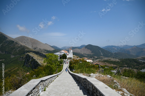 Landscape of Maratea, a village in Basilicata, Italy, with people walking down a stairway photo