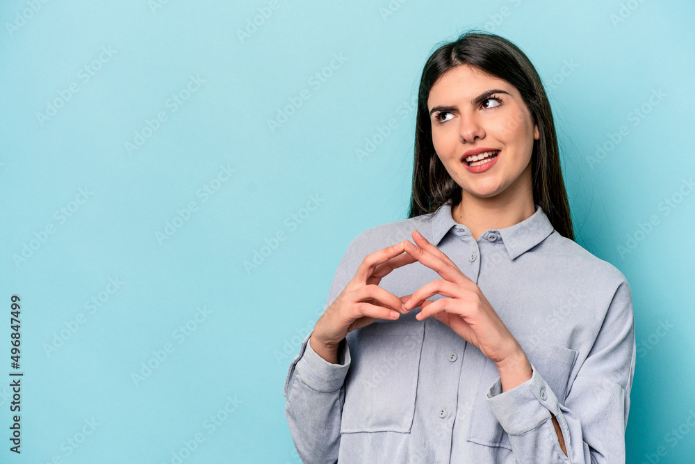 Young caucasian woman isolated on blue background making up plan in mind, setting up an idea. Young caucasian woman isolated on blue background making up plan in mind, setting up an idea.