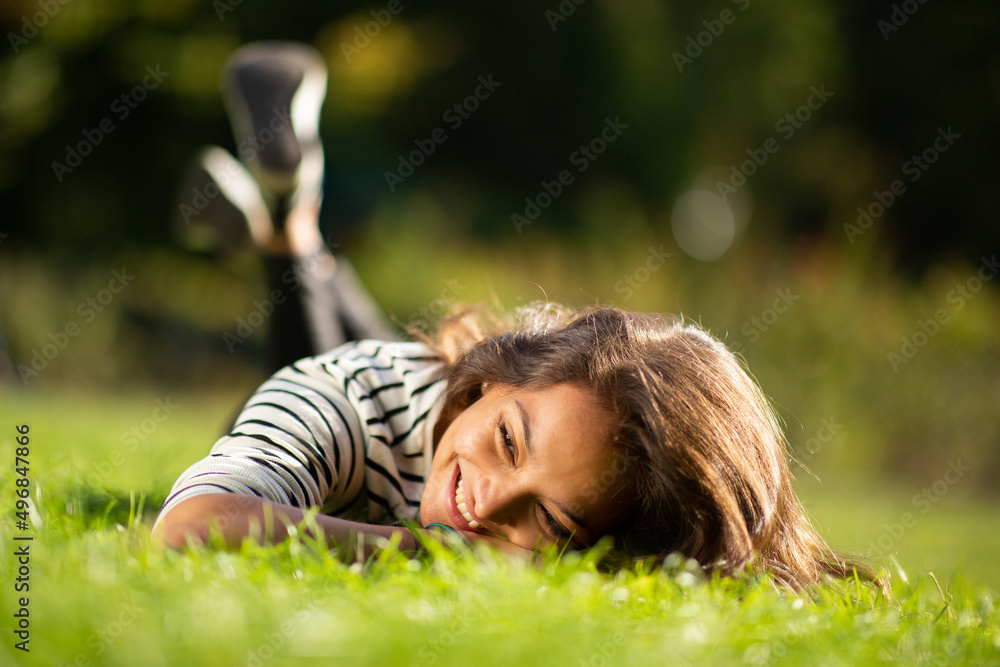attractive young woman relaxing in park attractive young woman relaxing in park