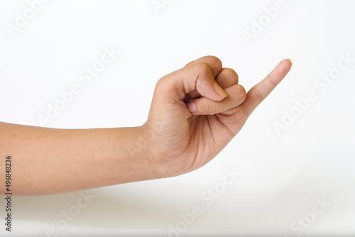Adult female hand showing pinky little finger or gesture of making a promise on a white background photo