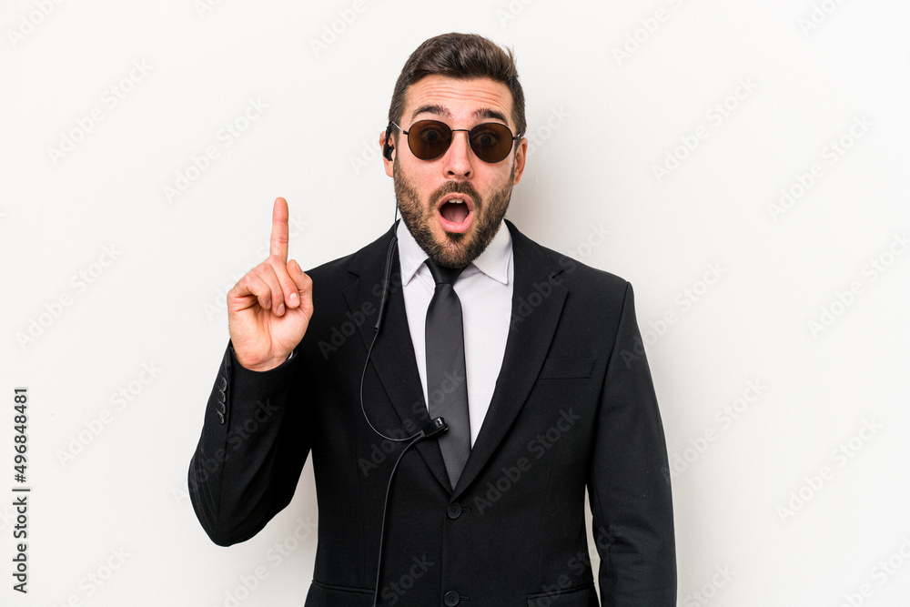 Young caucasian bodyguard man isolated on white background having some great idea, concept of creativity. Young caucasian bodyguard man isolated on white background having some great idea, concept of creativity.