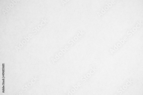 White recycled craft paper texture background. Cream cardboard texture vintage.