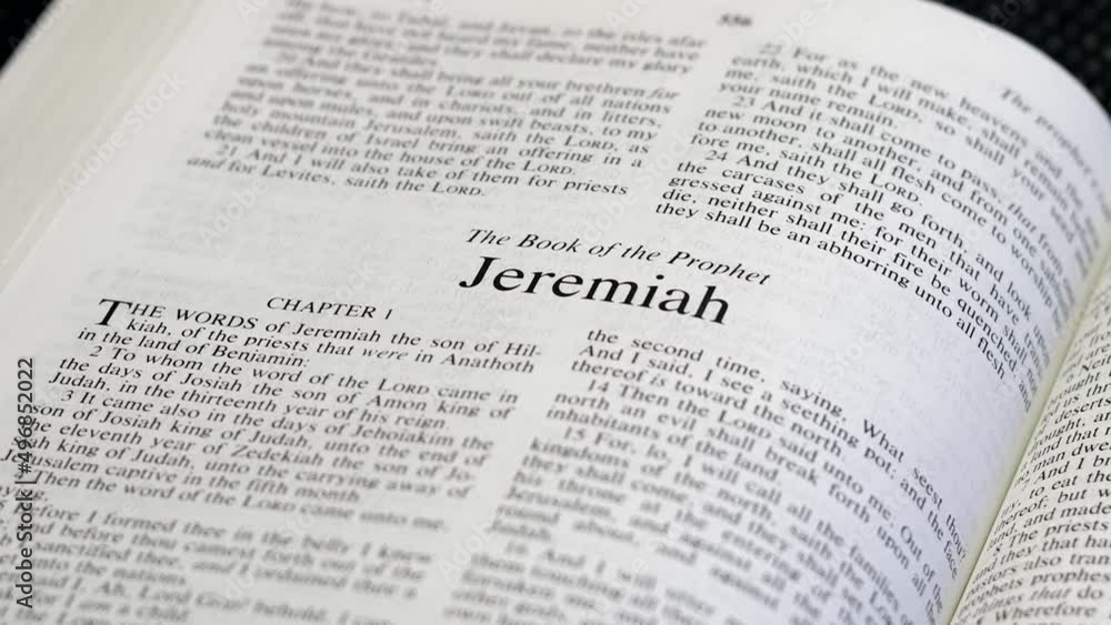 Close Up Shot of Bible Page Turning to the book of Jeremiah Close Up Shot of Bible Page Turning to the book of Jeremiah