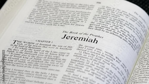 Close Up Shot of  Bible Page Turning to the book of Jeremiah photo