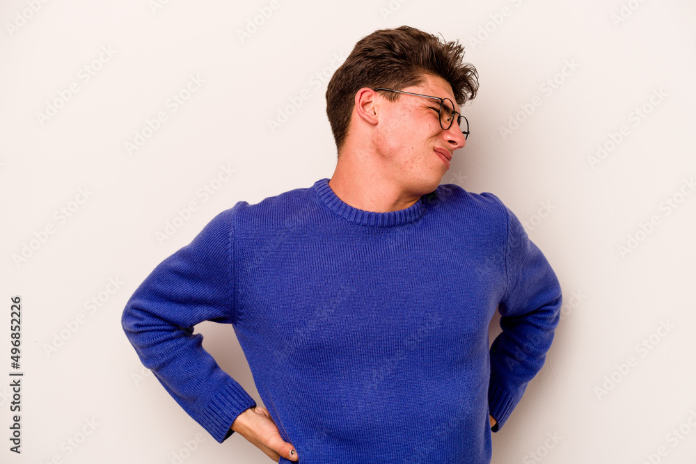 Young caucasian man isolated on white background suffering a back pain. Young caucasian man isolated on white background suffering a back pain.