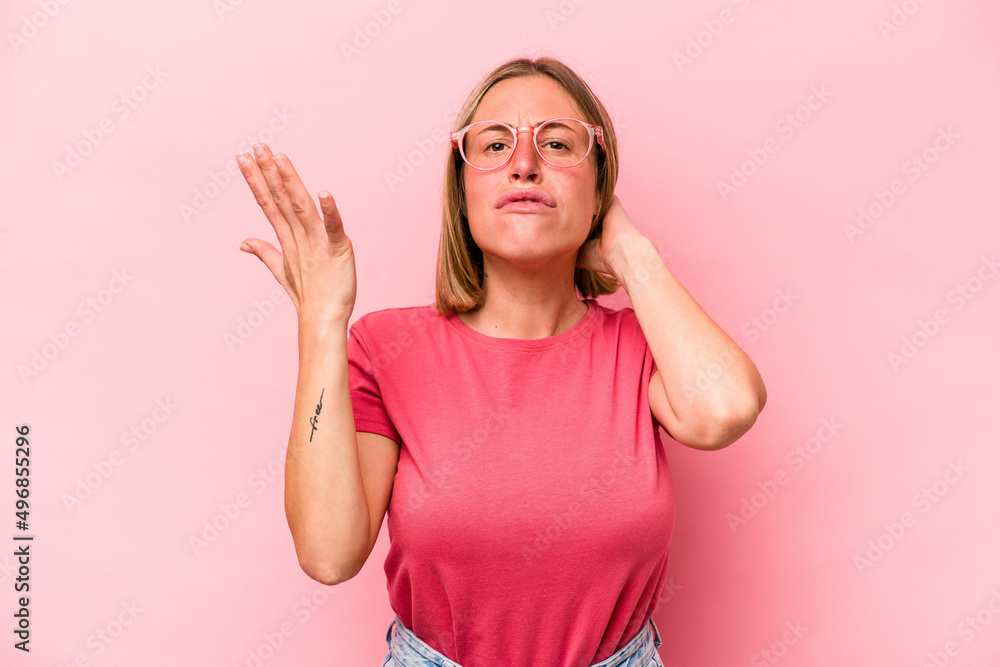 Young caucasian woman isolated on pink background screaming with rage. Young caucasian woman isolated on pink background screaming with rage.
