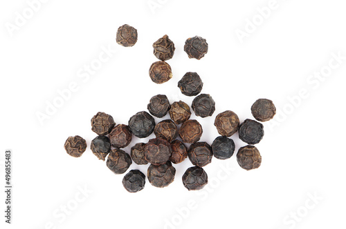 pile of black pepper seeds. isolated white background