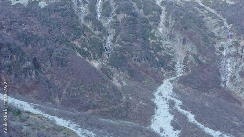 Digoriya gorge Sunrise Drone flying toward along waterfalls, Tuymazinsky glacier, Digoriya gorge, Northern Ossetia - Alania, Caucasus, Russia photo