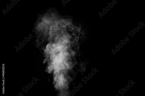 Perfect mystical curly white steam or smoke isolated on black background. Abstract background fog or smog, design element, layout for collages.