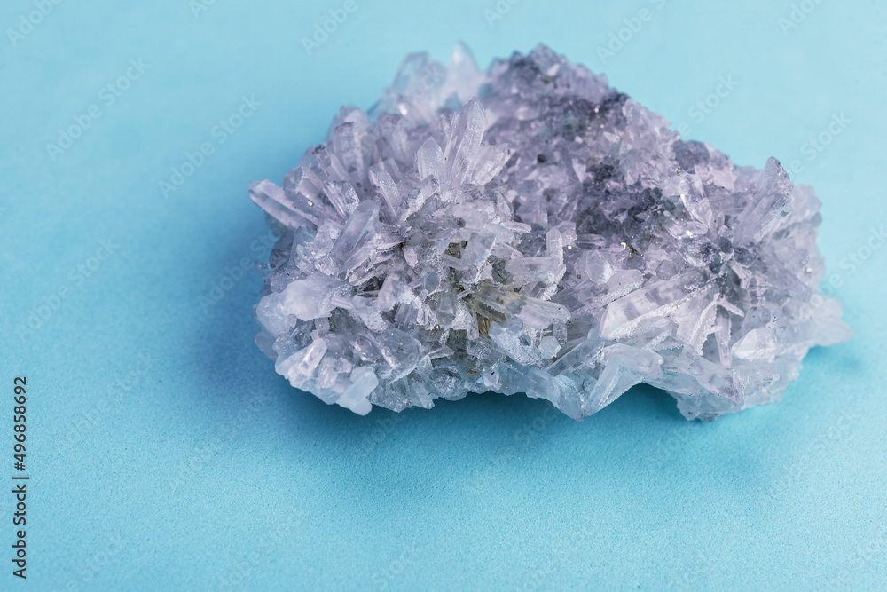 Crystal  on blue background  with quartz clusters for recreation and meditation. Crystals for esoteric  practice.