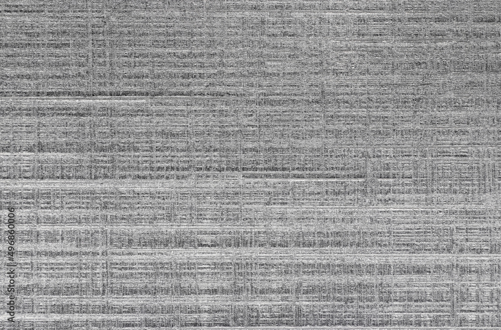 Textured brushed metallic background in silver color. Textured brushed metallic background in silver color.