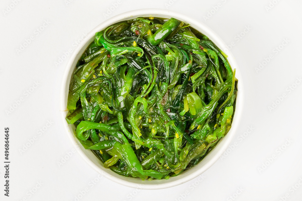 A bowl of pickled chukka. White background. Top view. A bowl of pickled chukka. White background. Top view.
