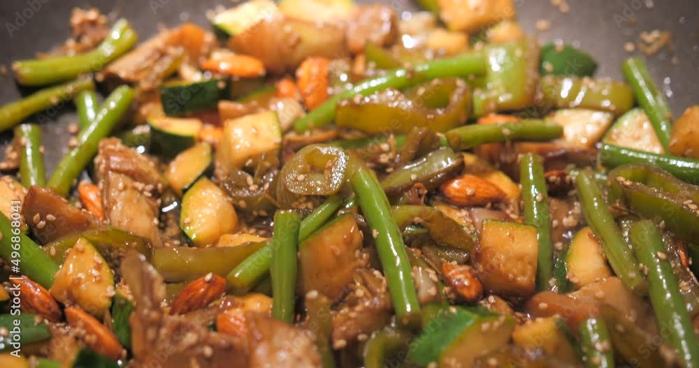 Asian Style Vegetables Cook In Wok Is Simmering Slowly On The Stove. Close Up Asian Style Vegetables Cook In Wok Is Simmering Slowly On The Stove. Close Up