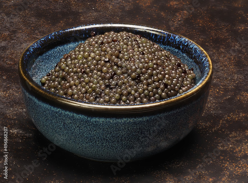 A small bowl of black lumpfish roe, a cheap caviar alternative photo