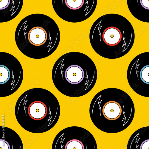 Seamless pattern with vinyl records on yellow background. Vintage music theme. Hand drawn doodle vector illustration.