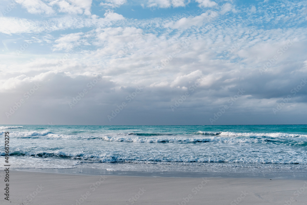 Scenic dramatic seascape.Waves, dark cloudy sky. Sandy beach of Atlantic Ocean, Varadero, Cuba