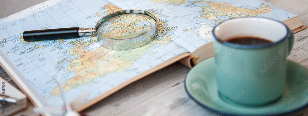 Horizontal banner or header with planning world tour with vintage magnifying glass and travel map - Journey trends, globetrotter and holiday concept - Adventures in the world