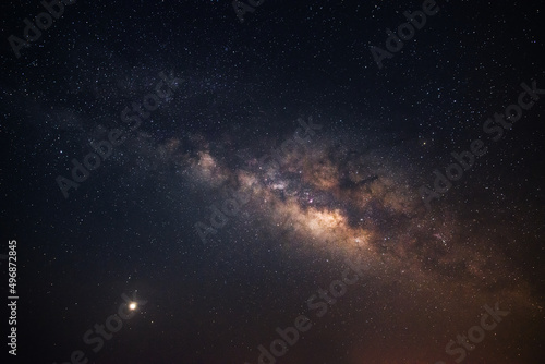 Milky way, amazing night sky and many stars on dark background. the universe is full of stars with noise and grain Photo taken with long exposure and white balance selected.