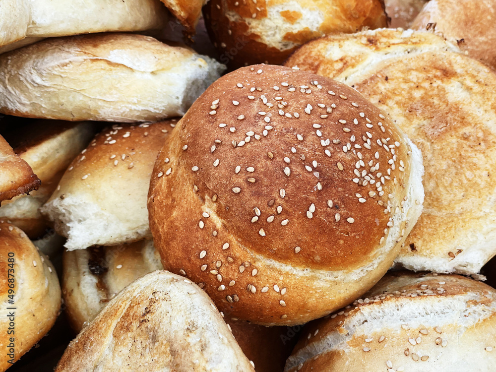 Breads called “cemita” for sale in a bread basket, along with other varieties such as “torta” breads Breads called “cemita” for sale in a bread basket, along with other varieties such as “torta” breads