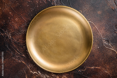 Metal plate on table. Food cooking and healthy eating background. Dark background. Top view. Copy space