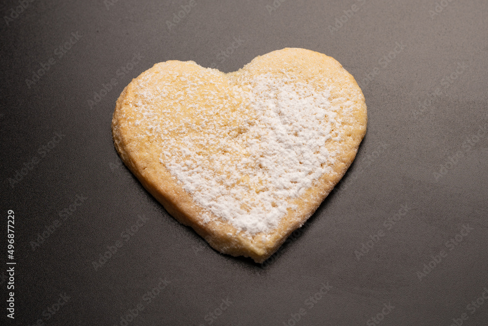 Shortbread in the shape of a heart isolated on white background. Shortbread in the shape of a heart isolated on white background.