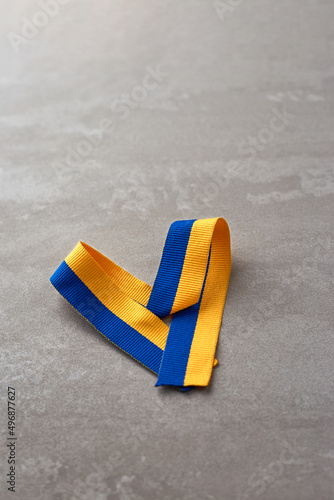 Ukrainian national flag colors on beton background. fabric of Yellow and blue colors. Ukraine nation independence celebration symbol photo