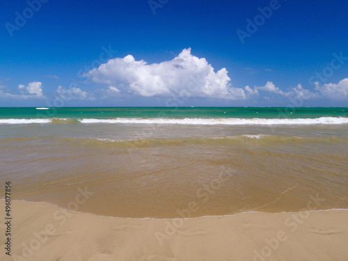 Fototapeta Naklejka Na Ścianę i Meble -  Beautiful turquoise waters and clean smooth sand of an Old San Juan Beach in Puerto Rico