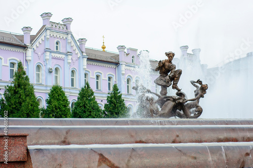 Sumy, Ukraine. August 22. 2014. Sadko Fountain with sculpture and water cascade. Banking Academy in the background photo