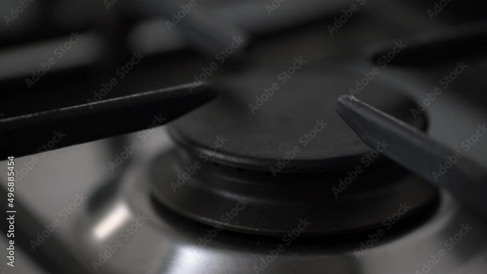 Burning gas, gas stove burner, hob in the kitchen. Slow motion gas cooker turning on and burning Burning gas, gas stove burner, hob in the kitchen. Slow motion gas cooker turning on and burning