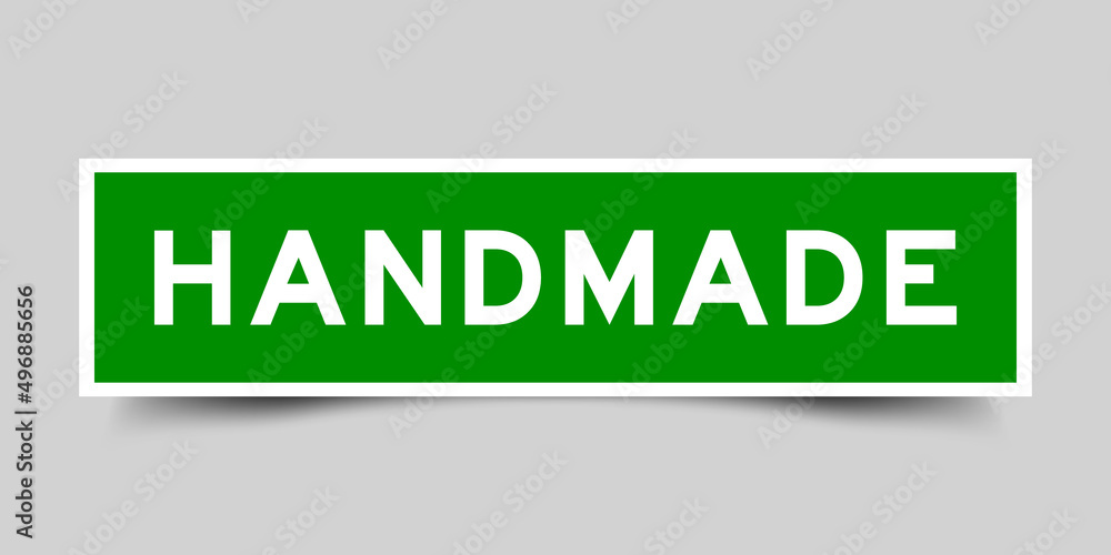 Fototapeta premium Sticker label with word handmade in green color on gray background