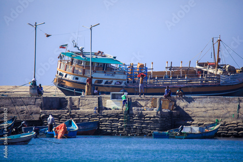 Berbera, Somaliland - November 10, 2019: Old, Rusted  and Colorful Fishing Boats and Ships in the Somalian Berbera Port photo