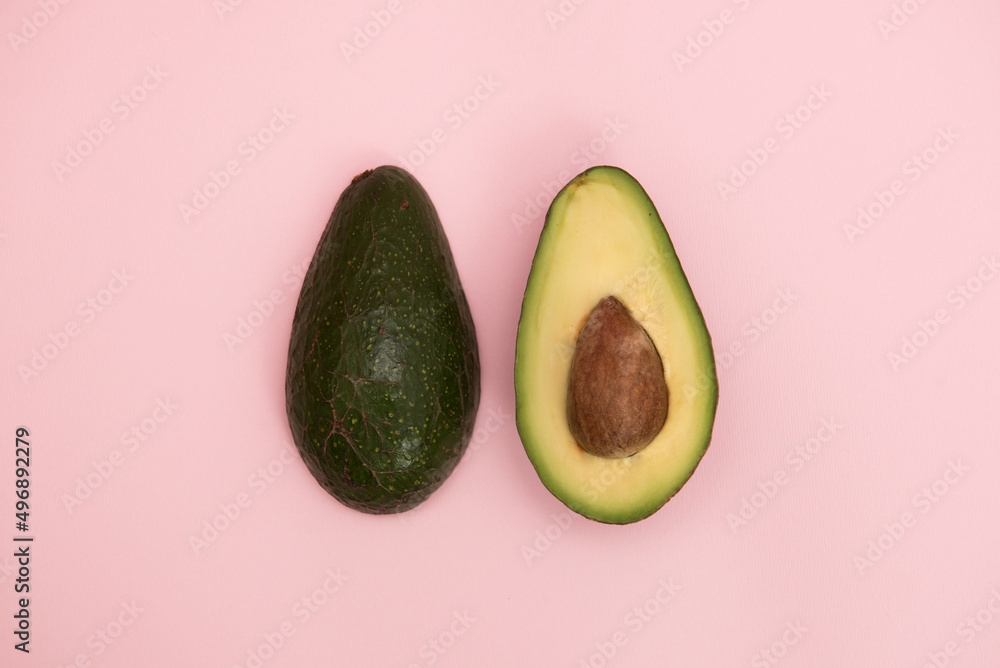 Avocado on a pink background Avocado on a pink background