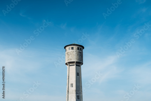 Old white tower blue sky