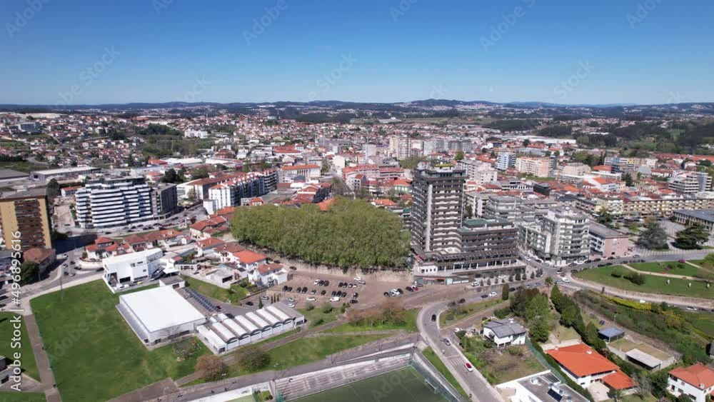 Santo Tirso, Portugal - April 3, 2022: DRONE AERIAL FOOTAGE - Apartment buildings, 25th of April Square (Portuguese: Praca 25 de Abril) and Santo Tirso City Hall. Santo Tirso, Portugal - April 3, 2022: DRONE AERIAL FOOTAGE - Apartment buildings, 25th of April Square (Portuguese: Praca 25 de Abril) and Santo Tirso City Hall.