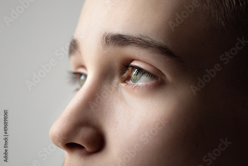 Fototapeta Naklejka Na Ścianę i Meble -  eye of a young man close-up, look up, natural eyebrows and eyelashes, vision check