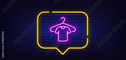 Neon light speech bubble. T-shirt line icon. Tee shirt with hanger sign. Fabric sport wear symbol. Neon light background. T-shirt glow line. Brick wall banner. Vector