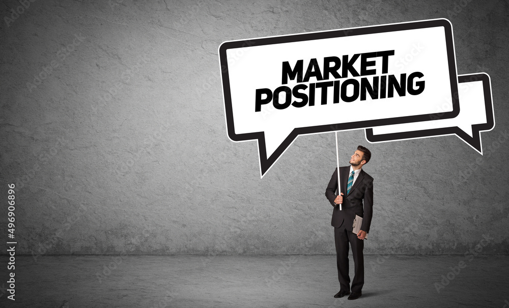 business person in casual holding road sign business person in casual holding road sign