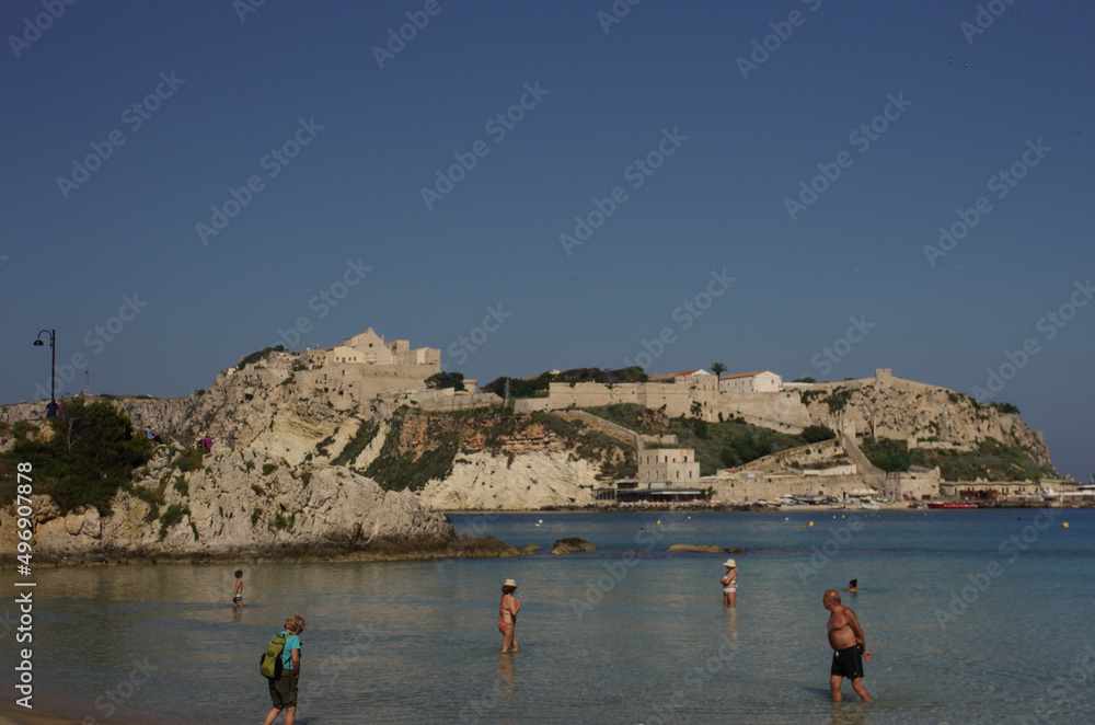 Archipelago of the Tremiti Islands, Adriatic Sea, Italy - In the foreground some tourists and in the background the Island of San Nicola